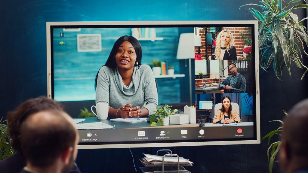 project management team attending videocall meeting with shareho